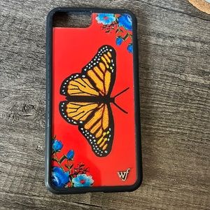 Wildflower phone case with a monarch butterfly. In gently used condition.